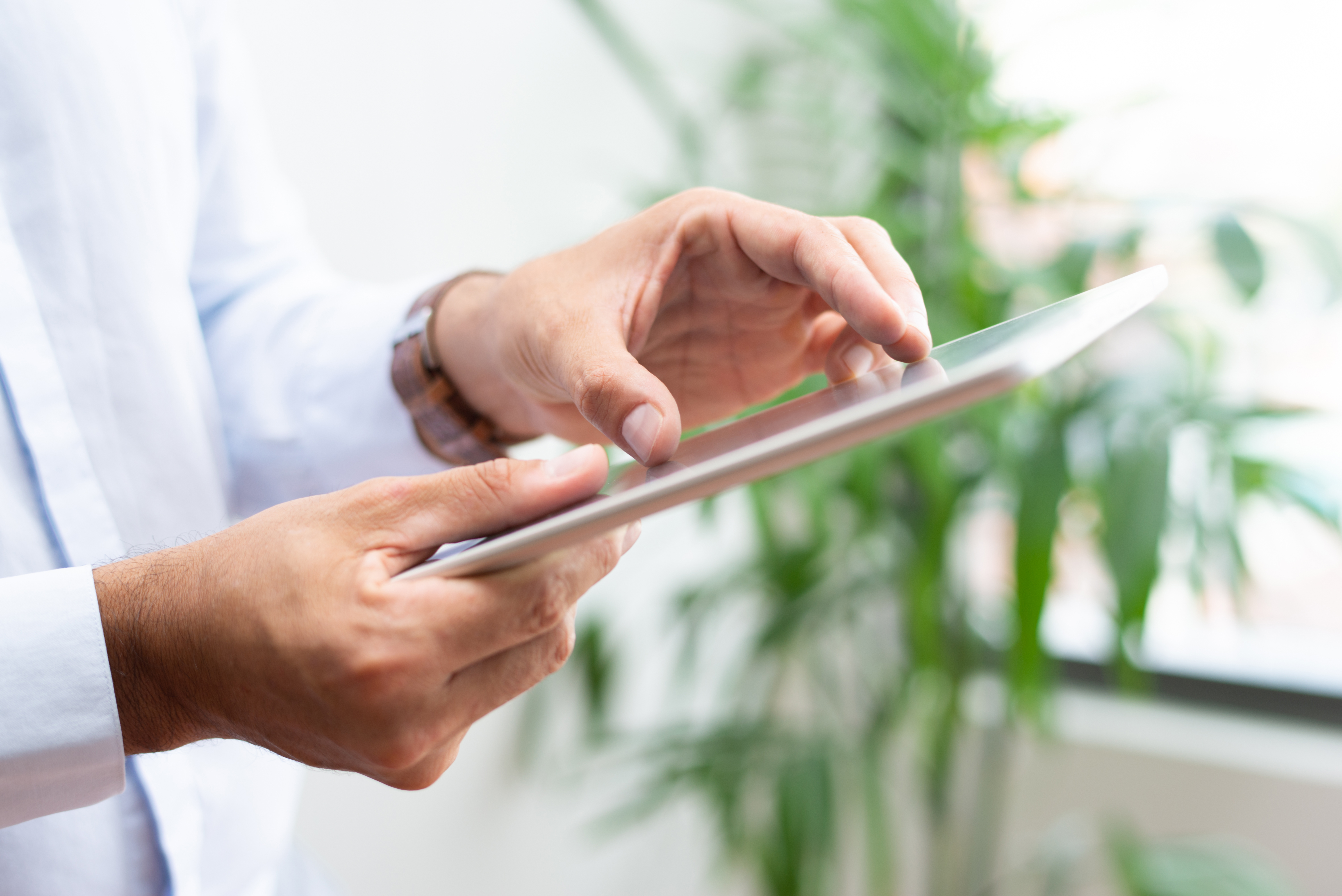 Doctor reviewing a product recommendation on a tablet